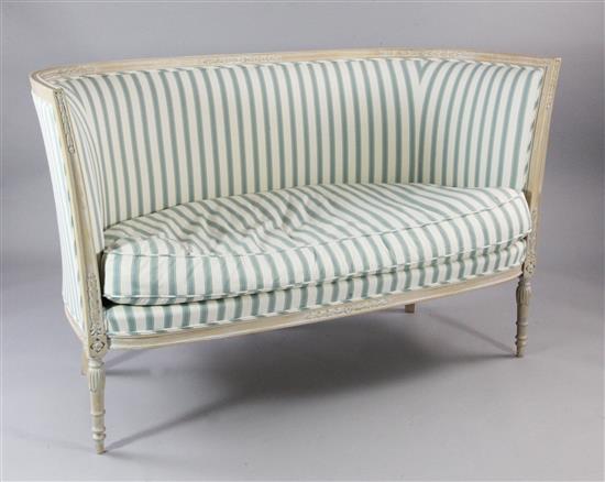 A Louis XVI style carved beech settee,